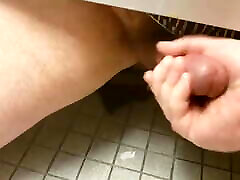 Giving a Hand Under the Stall with Cum