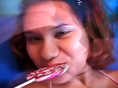 Indonesian Hottie Licks Her Lollipop