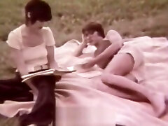 Young Couple Relaxing in the Nature 1960s Vintage