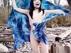 Asian slut is on the beach sakan tube posing