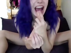Purple-haired tease with big smile, big tits, and a teeny waist