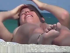A nude beach voyeur films a funny girl