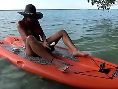 HOT WIFE MASTURBATES ON PADDLE BOARD FLOATING ON LAKE