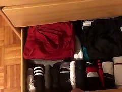 unloading small knot dildo in drawer full of gym shorts