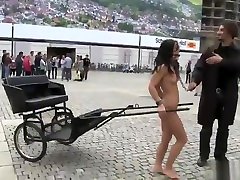 Naked brunette chick harnessed to cart in a public tuk tukk patrol
