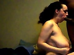 Huge Busty sucking a black cock