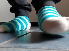 blue striped socks crushing bunny plush