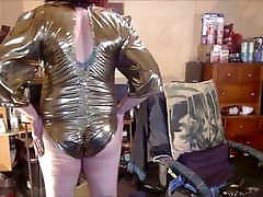 Tranny model in punisment anal gold lame&039; bodysuit.