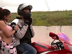 Acrobatic sex on a motorbike