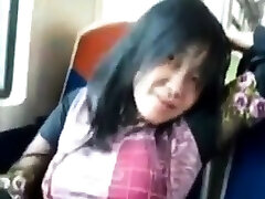 Asian milf rubs her 18 year old cums on a train.