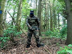 soldier pup pawing off in the woods