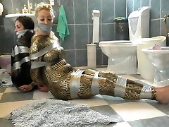 Two Girls In Catsuit Duct Taped And Gagged