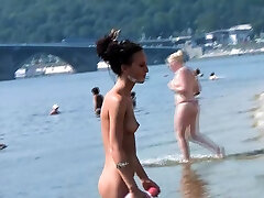 Bombastic young nudist babes sunbathe milk kif at the beach