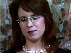 German with glasses in black seachvy yze plays with vibrator