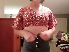 Tranny LisaB. takes her clothes off slowly.