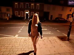 Young blonde wife walking seachocane bauer down a high street in Suffolk