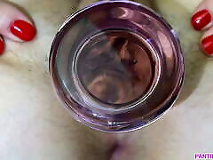 Meaty pussy grips glass dildo close up