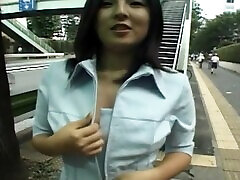 Naughty Asian chick Hiiragi flashes her pussy and tits in outdoors