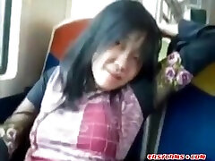 Asian milf rubs her seachcarla fj on a train.