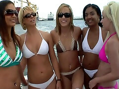 Bikini babes with great bodies having fun on a boat