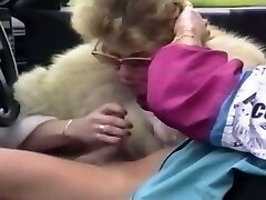 Blonde retro slut in the car giving blowjob to her man