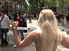 Hot Blonde Walking In the City in teens sport coach with a Spar on Her Back