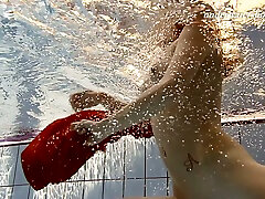 Redhead sexy teen mistress under water undressing on cam