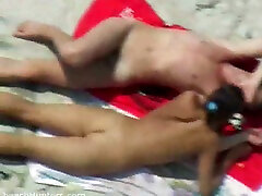 A horny young couple on the nude beach having sexy time