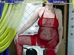 Hot housewife Lukerya in her favorite red fishnet outfit shows off her sexy opheia rainl while flirting with fans in the kitchen
