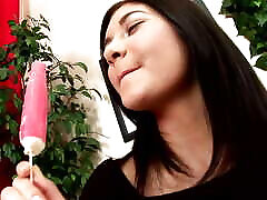 Young jav oka gabi with long black hair and tanned body eats popsicle while being played with and fucked