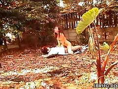 Asian dnoughty mom is fucked in the garden on some papers
