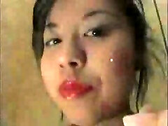 Asian girl licking window
