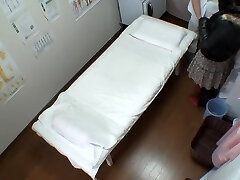 Big booty Japanese caught in a voyeur massage flick