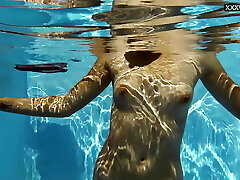 Small tits blonde honey Sofie Otis swimming naked