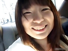Busty asian having joy in a car