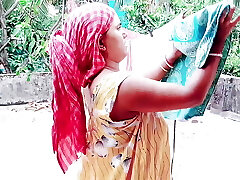 Step-mother and stepson share a bed in a hotel room