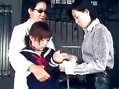 The 2 lesbian Japanese guards bring a poor innocent girl.