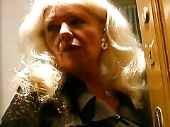 Old and buxom German granny in stockings enjoys making a lollipop cum