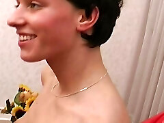A slim German honey gets her small boobs sprayed with cum