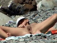 Chick mounted on a beach