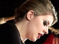 A caged slave gets strapon buttfuck sex