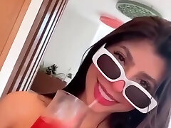 Solo dark haired chick drinking and having fun in a homemade video