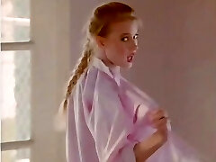 Fair-haired Bonnie Marino has a photosession on a beach