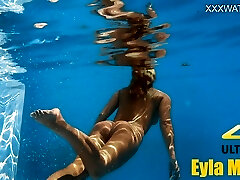 Eyla Moore, a well known model, glides elegantly through the water