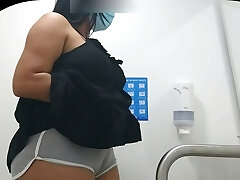 CAMERA CAPTURING CAMELTOE OF Chick WITH BIG ASS IN PUBLIC Bathroom