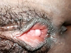 Fingering and stretching my dark-hued GF's hairy punani in close-up video