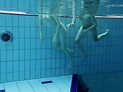 Cute teen girl Anna Netrebko swims naked with her GF