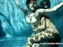 Zuzanna and Lucie toying underwater