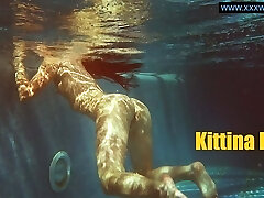 Kittina submerges herself in to the red-hot pool