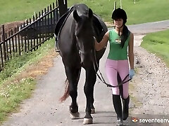In the barn this cowgirl rides a cowboy in a hay crammed stall